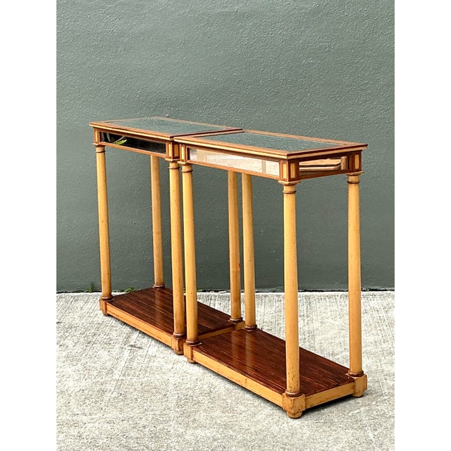 This sophisticated pair of side tables expertly blends Neoclassical elegance with French Directoire-style influences....