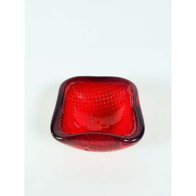 A small bowl attributed to Carlo Scarpaa for Venini, it is made of blown glass using the square Bullicante technique, a...