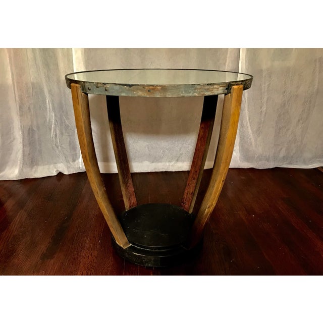 Unique Rustic Wine Barrel Table. Hand crafted from a real vineyard barrel. Four wooden staves support the mirrored top....