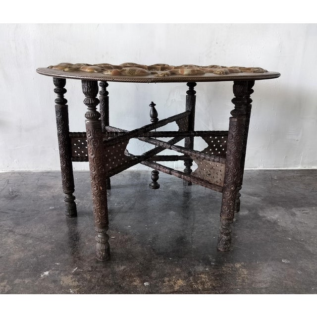Lovely, Vintage Moroccan tea/hookah table with round ornate, inlaid and embossed brass top; has unique parade of animals...
