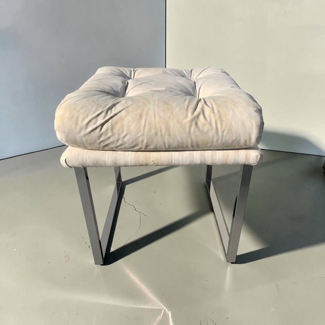 Chrome and upholstered stool attributed to Milo Baughman. This stool has a sleek, chrome frame, with a classic Mid-Century...