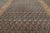 Hand-knotted in wool and dating to circa 1950–1960, this vintage 13x19 Persian rug is a sophisticated example of an all-...