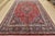An authentic vintage traditional Mashad rug hand-knotted with fine wool and natural dyes. This oriental rug features a...