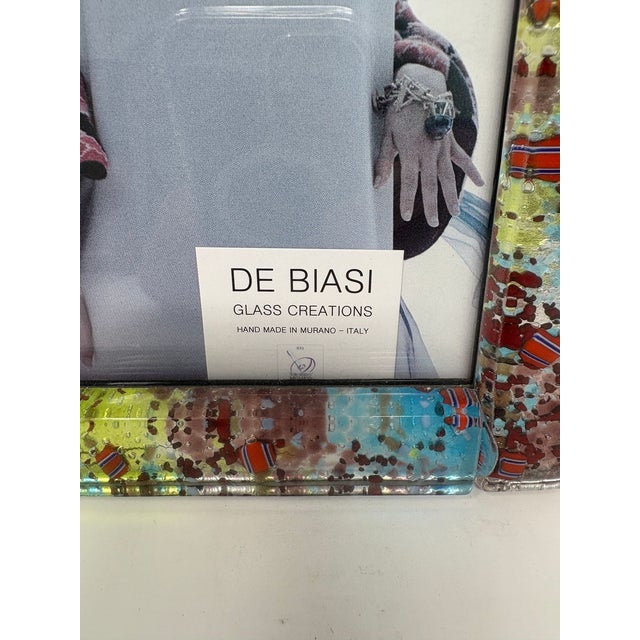 Beautiful Murano Glass picture frame. Brand new. Created by one of the top Artists in Murano. Measures 7.5" x 5.5".