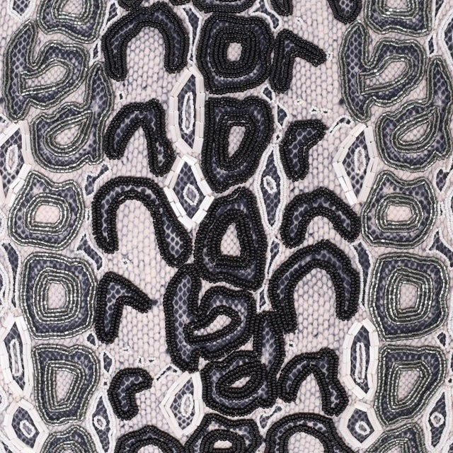 Striking pillow ambitiously hand decorated with Czech glass beads, signed Elizabeth Phillips Design on the back.