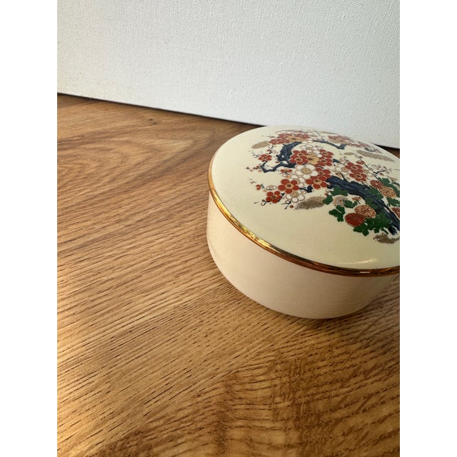 Up for consideration is a beautiful vintage Asian white ceramic box with cherry blossom accents. This would look lovely on...