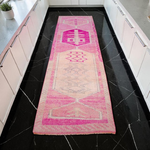 This exquisite hand-knotted runner, hailing from the 1960s in Eastern Anatolia, is a testament to the bold artistic...