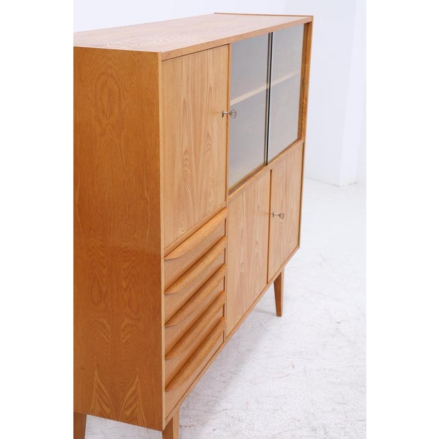 Hellerau Highboard, Series 602, from the 1960s Original Hellerau display cabinet, Series 602 • Designed by Franz Ehrlich •...