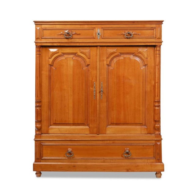 Mid-century cabinet, late 19th century, Southern Germany, circa 1870; cherry wood; two doors; one large drawer below the...