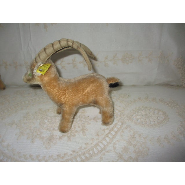 Experience the charm of a vintage Steiff plush toy with the Rocky Mountain goat, a delightful collectible from the 1960s....
