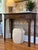 A burl wood top and just the right amount of Chippendale-style fretwork give this super solid console table by renowned...