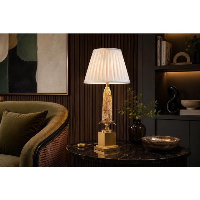 Decorative brass table lamp dating to the 1970s, modelled as an ear of corn. Individually textured kernels rise above a...