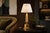 Decorative brass table lamp dating to the 1970s, modelled as an ear of corn. Individually textured kernels rise above a...