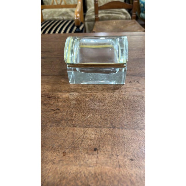 A thick, heavy solid clear glass trinket or salt box featuring a fitted glass lid, thickbeveled walls, and a recessed...