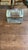 A thick, heavy solid clear glass trinket or salt box featuring a fitted glass lid, thickbeveled walls, and a recessed...