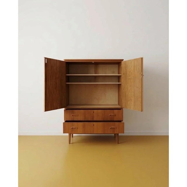 Vintage 1950s Danish teak wardrobe, W. 82 D. 40 H. 118 cm. Dimensions: Width: 82 cm Depth: 40 cm Height: 118 cm Design and...