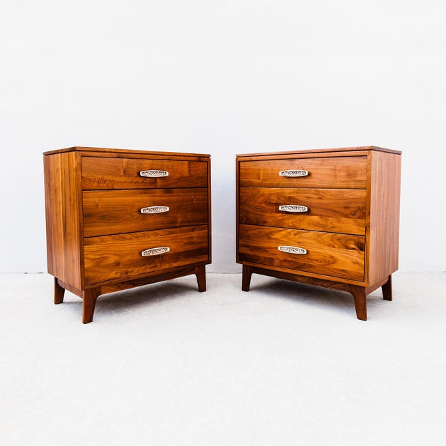 Expertly restored pair of solid walnut three drawer commodes by Woodland, made in Southern California in the 1970s. Place...