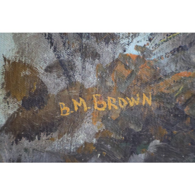 An original oil on canvas signed B. M. Brown, depicting a quiet cottage landscape framed by golden autumn trees....