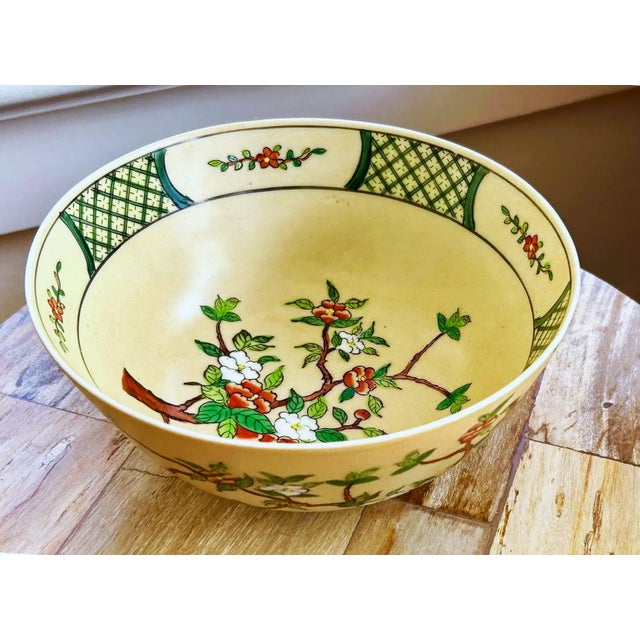 Apple blossom design on an antique white background. Very pretty color combination. The interior part of the bowl near the...