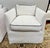 Chic pair of Serena & Lily white slipcovered swivel chairs with clean-lined arms and tailored skirts, finished with crisp...