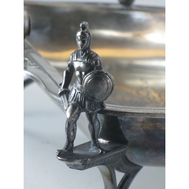 Silver-Plated Cake Basket with Soldiers and Hunt Motifs Has the mark of Wilcox Silverplate Co., second half of 19th...
