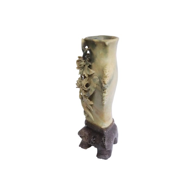 A finely carved Chinese soapstone vase showcasing an elaborate high-relief composition of blooming peonies, scrolling...
