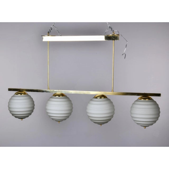 New Italian Fixture With 4 Pale Taupe Globes on Horizontal Brass Bar For Sale - Image 10 of 12