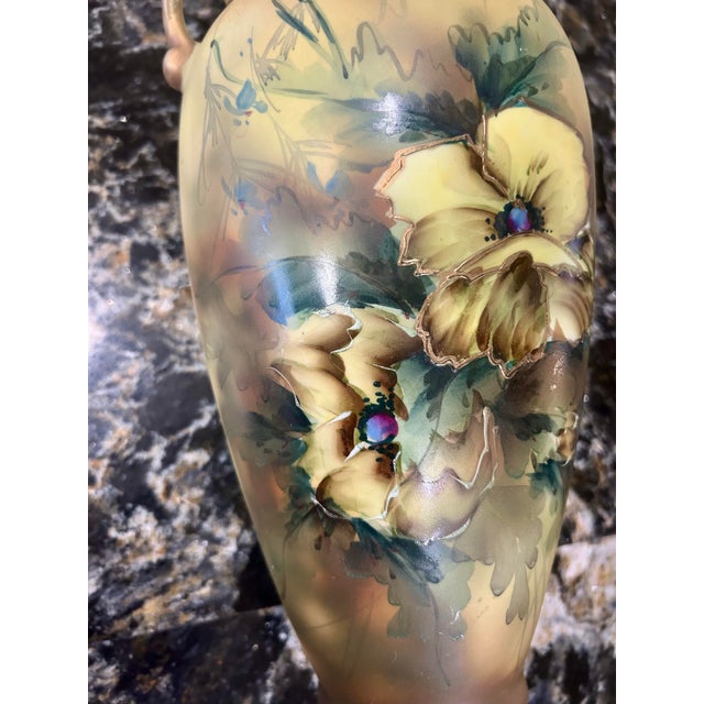 This vase is an antique, hand-painted, Royal Nippon Nishiki porcelain vase with gilded accents and a ruffled lip. It was...