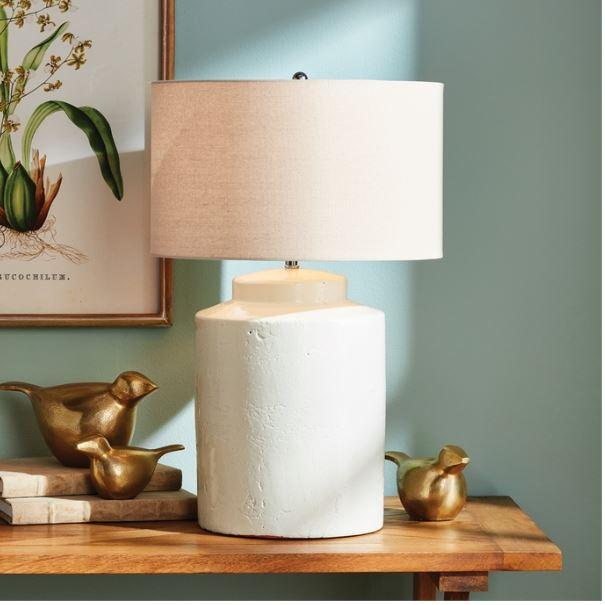 In a classic white ceramic with a thickly-applied glaze, this lamp is made for the transitional setting. A generously...