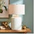 In a classic white ceramic with a thickly-applied glaze, this lamp is made for the transitional setting. A generously...