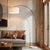 The Float Arc Lamp is a dimmable modern arc lamp with a black nickel steel body, offering adjustable light through a...