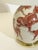 A chinoiserie porcelain table lamp by porcelaine de paris, france, dating to the 1970s, featuring vibrant copper red...
