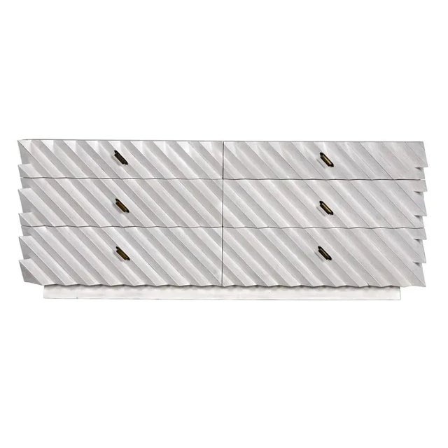 The Hikaru Dresser boasts spacious dimensions, measuring 76 inches in width, 23 inches in depth, and 30 inches in height....