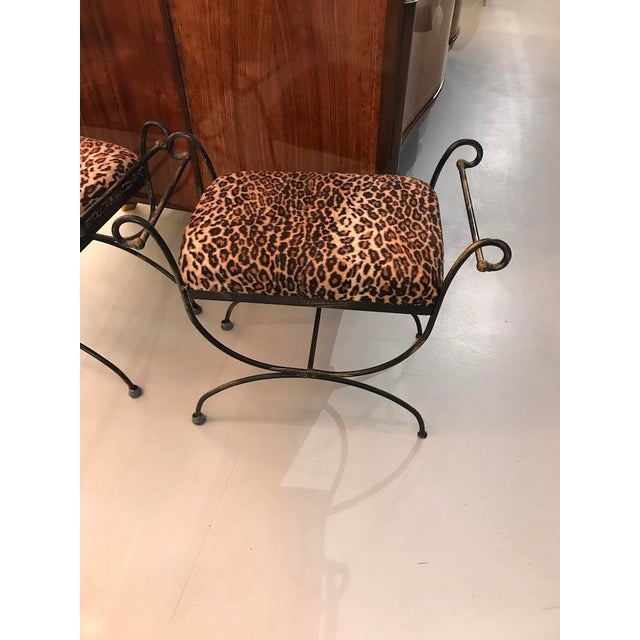 Pair of Mid-Century Modern iron bench with leopard upholstered print.