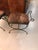 Pair of Mid-Century Modern iron bench with leopard upholstered print.