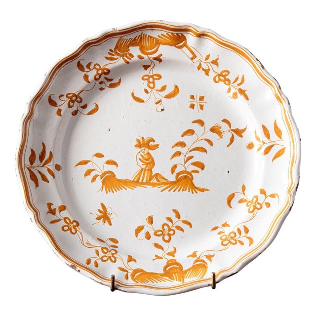 Antique Shaped Ochre Plate with Figure from Moustiers Faience, 1700s For Sale