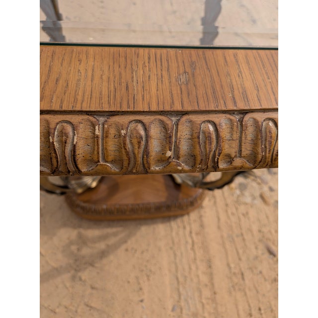 Sturdy Bernhardt side/end table with glass. This table has a metal flower insert that gives it a French decorative look....