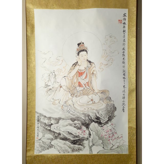 Chinese mountain throne Kuan Yin scroll, in freely drawn, colored inks on silk, mounted on a shimmering and matte golds,...