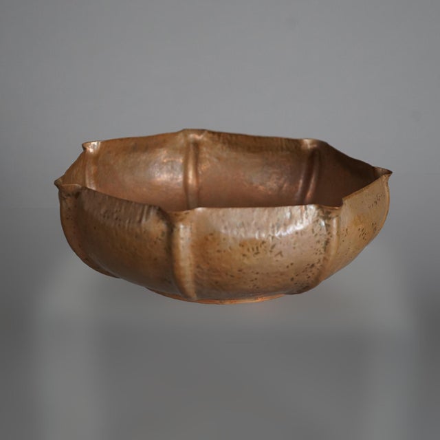 An antique Arts and Crafts center bowl offers hammered copper construction with maker stamp on base as photographed, c1910...