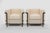 Pair of LC2 Armchairs, designed by Le Corbusier in 1928 and realized by Cassina in 1970s. Upholstered in cream silk....