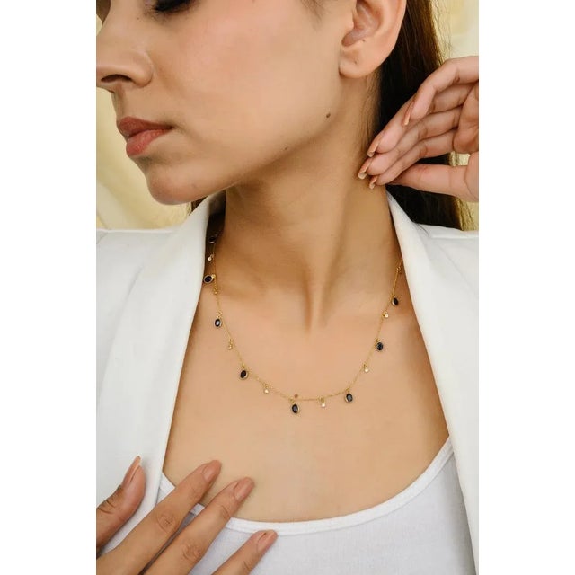 This is part of Chairish’s Fine Jewelry assortment. Blue Sapphire and Diamond Charm Layering Necklace in 18K Gold with...