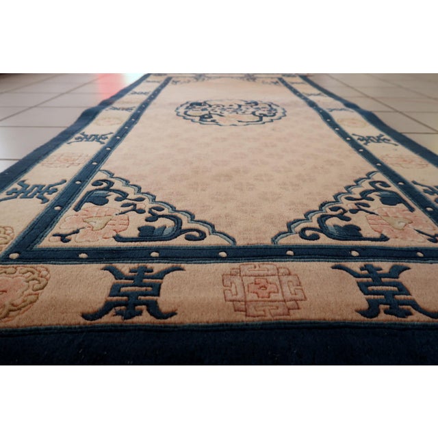 A stunning example of mid-century textile art, this vintage Chinese Art Deco rug captures the elegance and bold styling of...