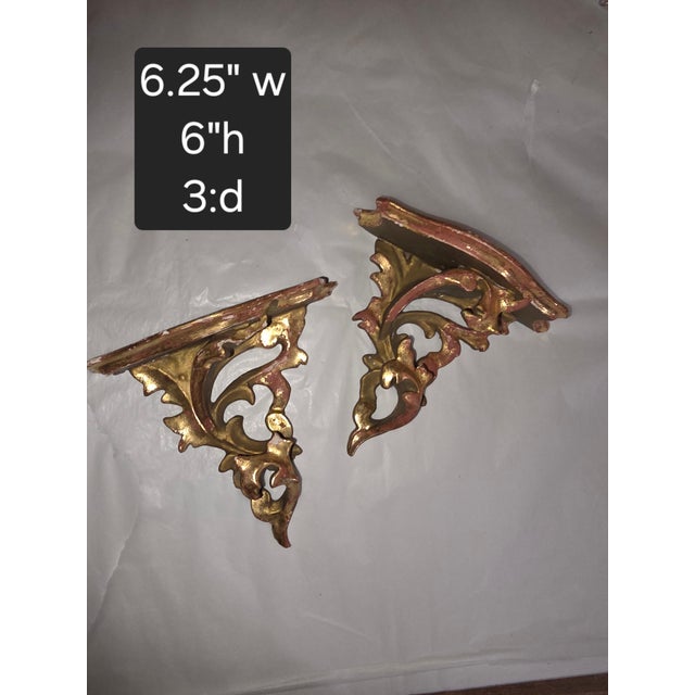 Small pair of Italian Giltwood wall shelf brackets.