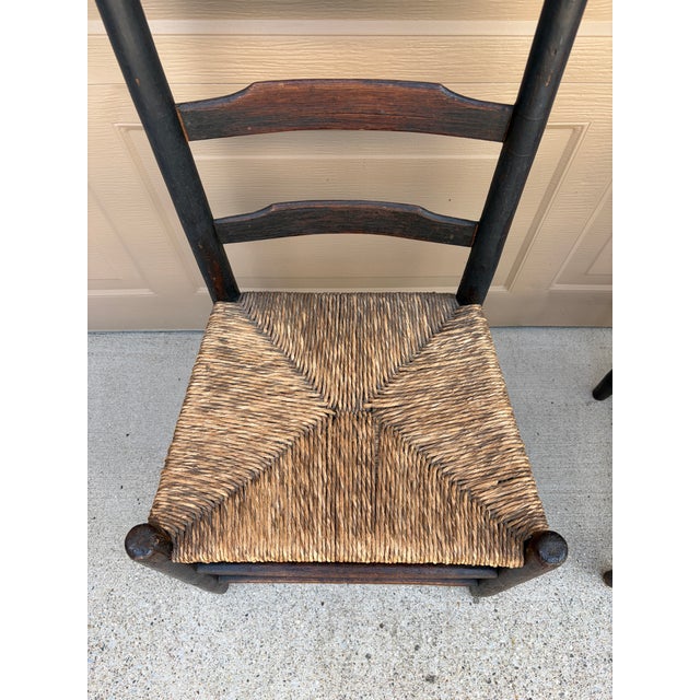 Wood Pair of Antique Black Painted Shaker Ladder Back Chairs With Rush Seats For Sale - Image 7 of 18