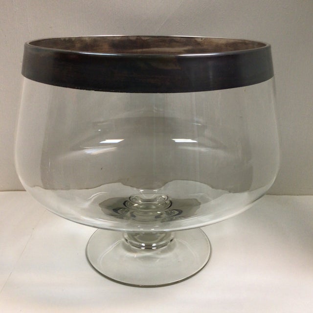 Large Dorothy Thorpe style table center piece pedestal bowl with sterling silver band and two floral vases. The vase’s at...