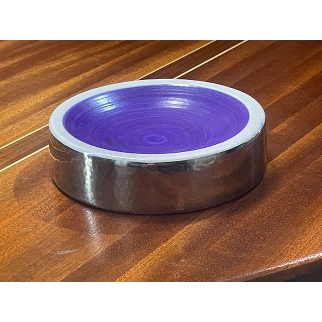 A stunning example of high-style Italian pottery from the mid-century era. This low, circular bowl features a brilliant,...