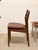 A handsome set of four vintage Danish modern dining chairs crafted in richly toned rosewood. Each chair features a...
