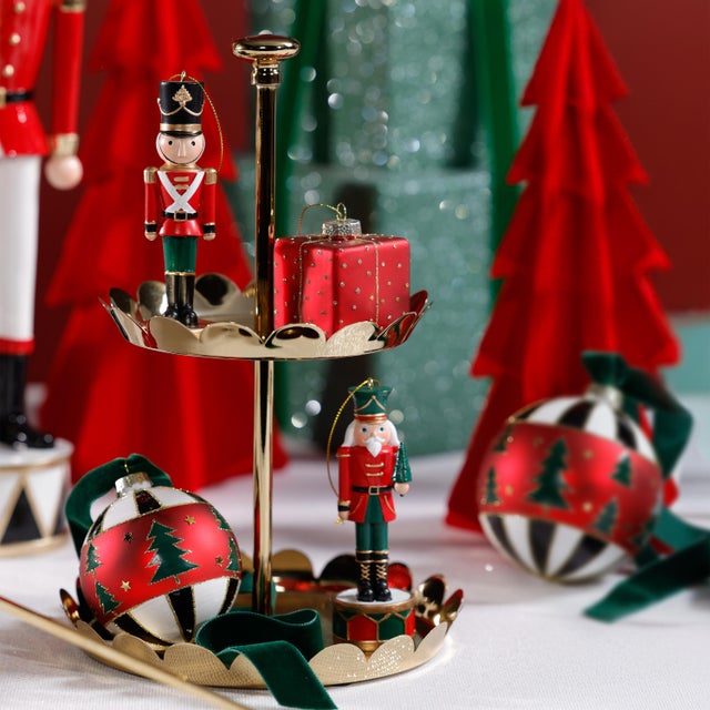 Petite in scale but big on charm, this polished metal display tray features elegant scalloped edging and a sleek central...