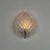 A poetic single wall light designed by fritz kurz for orrefors, sweden, featuring a beautifully sculpted leaf-shaped...