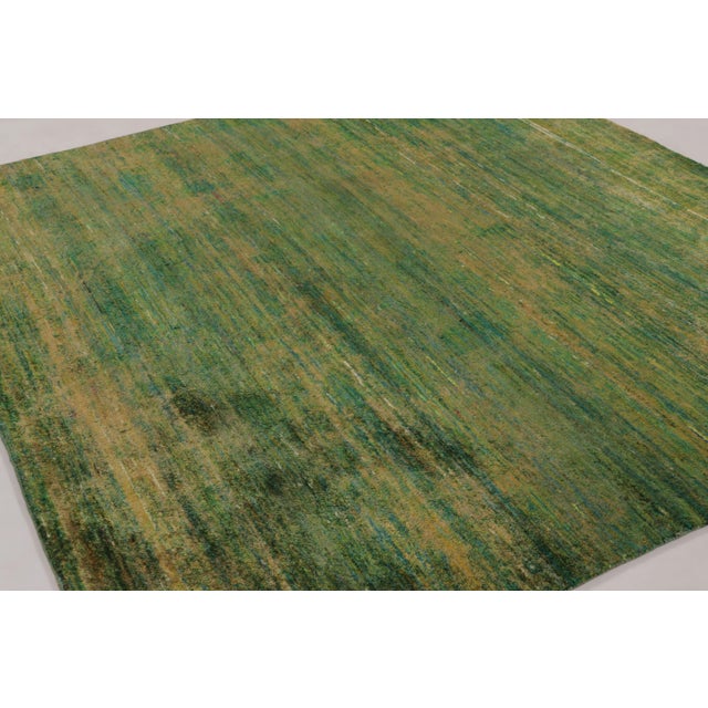 Made with a luxurious hand-knotted silk, this contemporary 7x8 rug is a rich new addition to Rug & Kilim’s Textural rug...